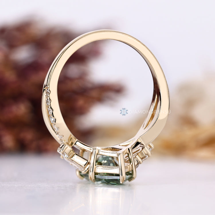 Dutch marquise ring with side stones and leaf prongs.