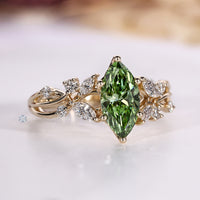 Marquise diamond ring with round side stones.