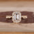 Emerald Cut Diamond Ring with pave round diamonds.
