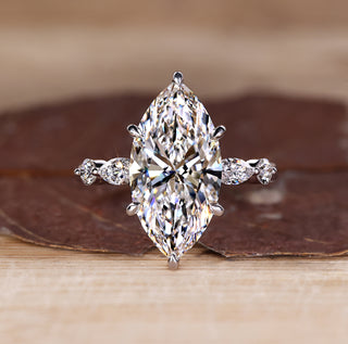 5 stone diamond ring with marquise centre and round side stones.