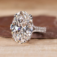 Double row pave engagement ring with oval lab grown diamond.