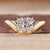 Oval cut lab grown diamond solitaire ring with elegant wavy band