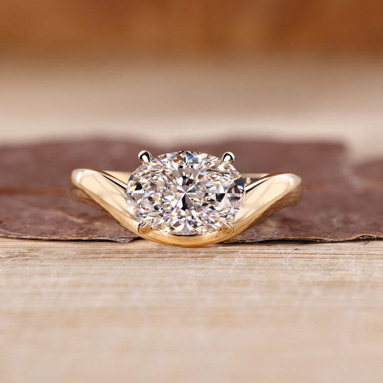 Oval cut lab grown diamond solitaire ring with elegant wavy band