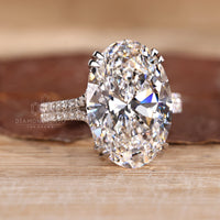 Trellis setting ring with oval lab grown diamond.