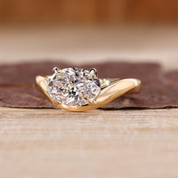 Modern oval lab grown diamond ring featuring flowing wavy band