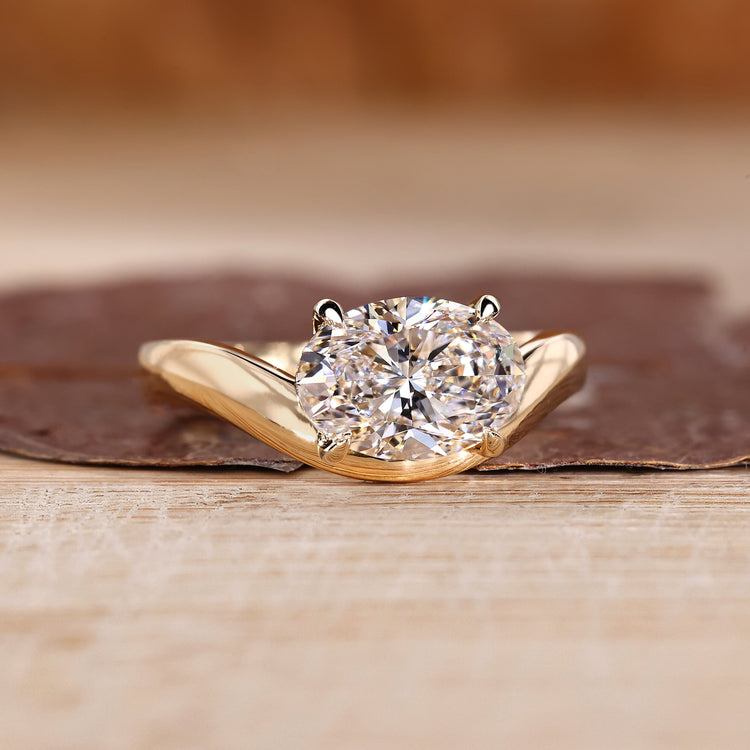 Oval cut lab grown diamond ring with artistic wavy setting