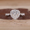 Heart Cut Diamond Ring with pave round diamonds.