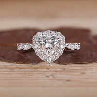 Heart Cut Diamond Ring with pave round diamonds.