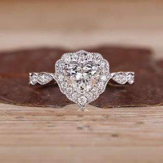 Heart Cut Diamond Ring with pave round diamonds.