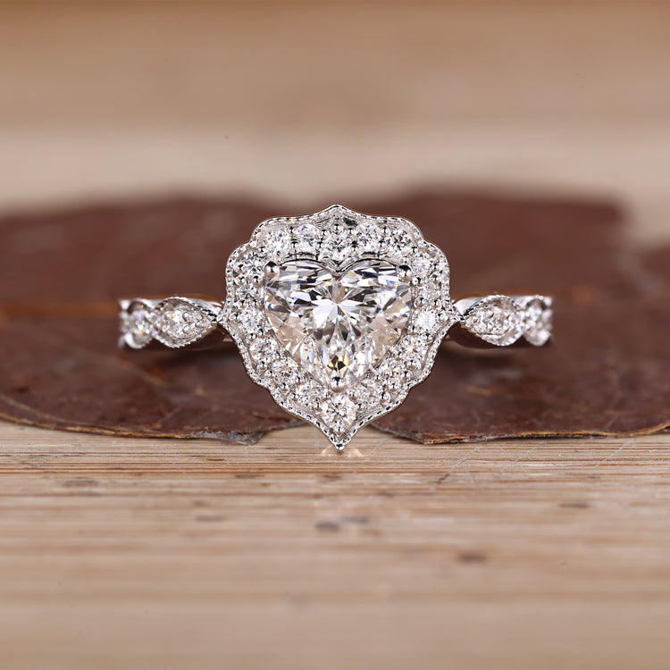 Heart Cut Diamond Ring with pave round diamonds.