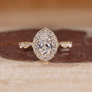 Oval Cut Diamond Ring with pave round diamonds.