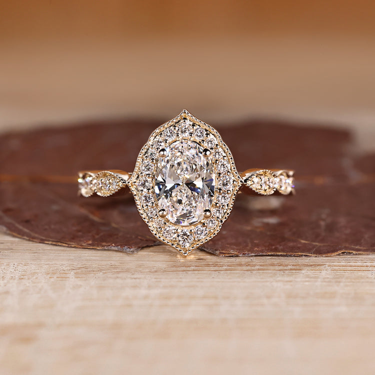 Oval Cut Diamond Ring with pave round diamonds.