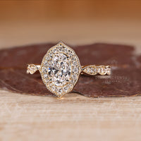 Oval Cut Diamond Ring with milgrain detailing.