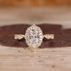Cushion Cut Diamond Ring with pave round diamonds.
