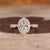 Cushion Cut Diamond Ring with pave round diamonds.
