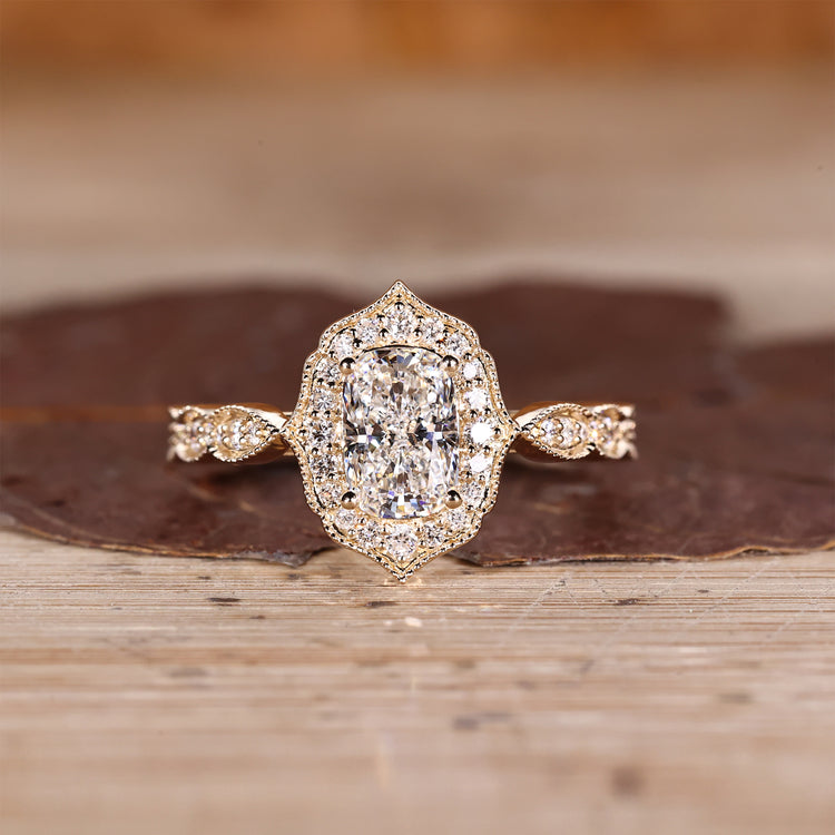 Cushion Cut Diamond Ring with pave round diamonds.
