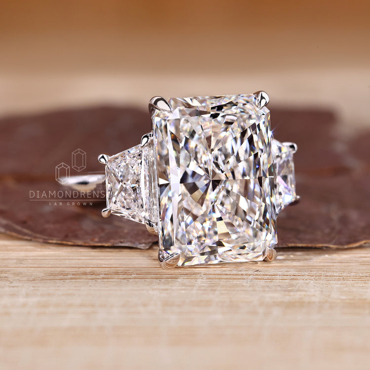 Handmade ring with radiant cut centre and trapezoid side stones.