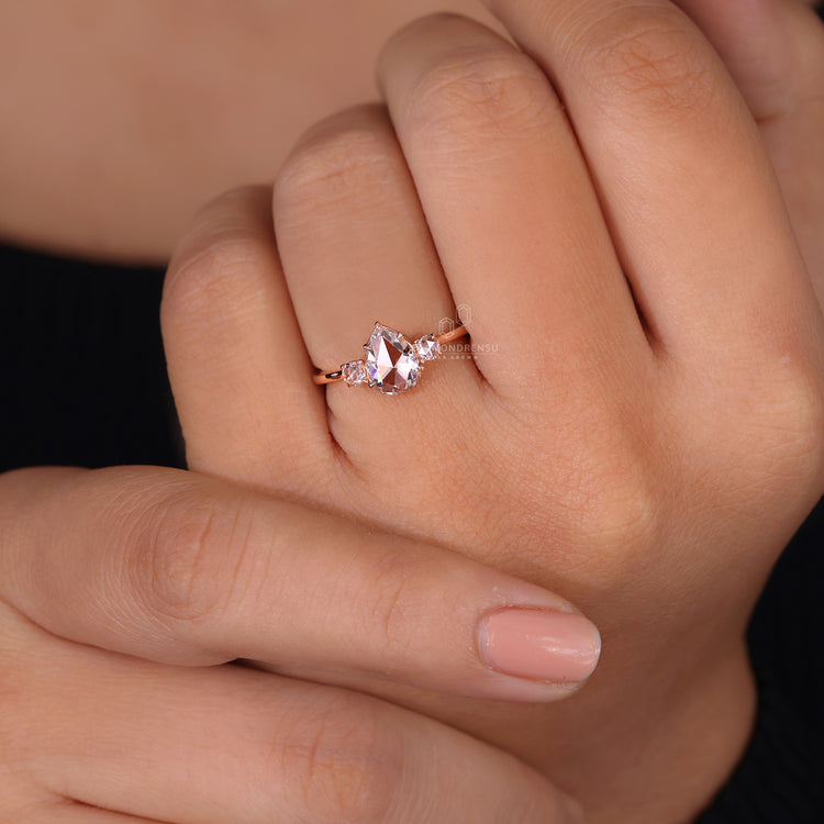 Round rose cut side stones ring in claw prong setting ring.
