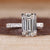 Handmade ring with emerald cut diamond and pave design.
