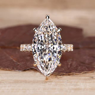 Marquise diamond ring with hidden halo engagement design.