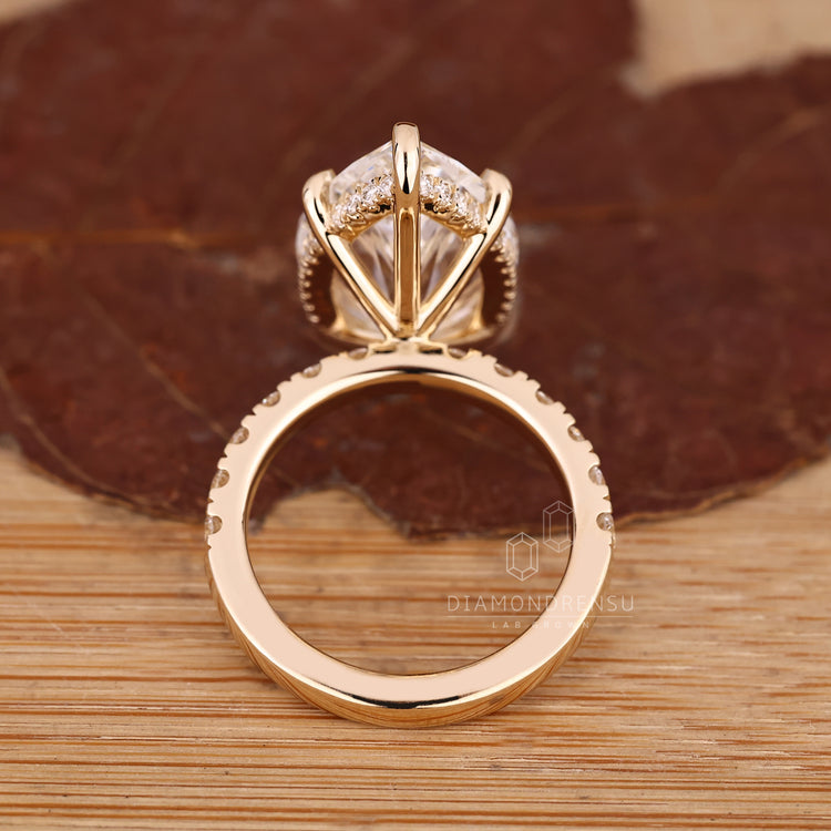 Handmade jewellery marquise ring with hidden halo detail.