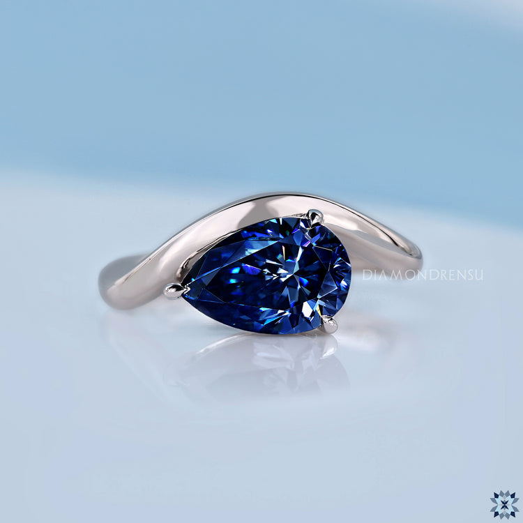 East to west set pear cut moissanite ring design.