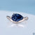 pear cut moissanite ring in solitaire style with east to west setting.