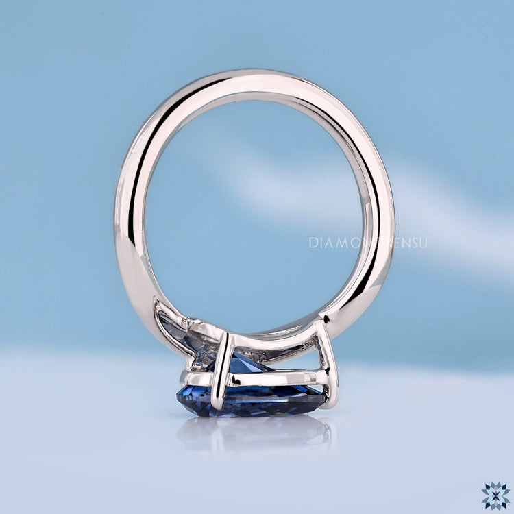 Pear cut solitaire moissanite ring with modern handmade finish.