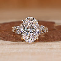Oval Cut Diamond Ring with marquise and round stones.
