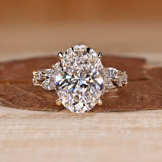 Oval Cut Diamond Ring with marquise and round stones.
