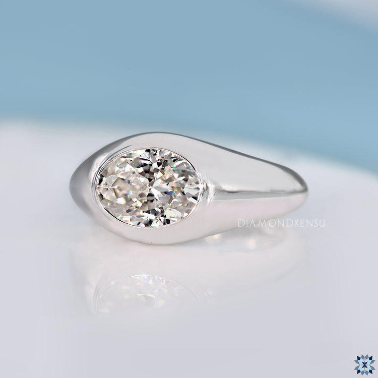 Handmade oval cut engagement ring with gypsy setting.