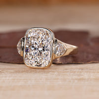 Cushion Cut Diamond Ring with tapered shank style.
