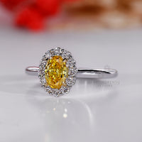 4 claw prong oval diamond engagement ring.
