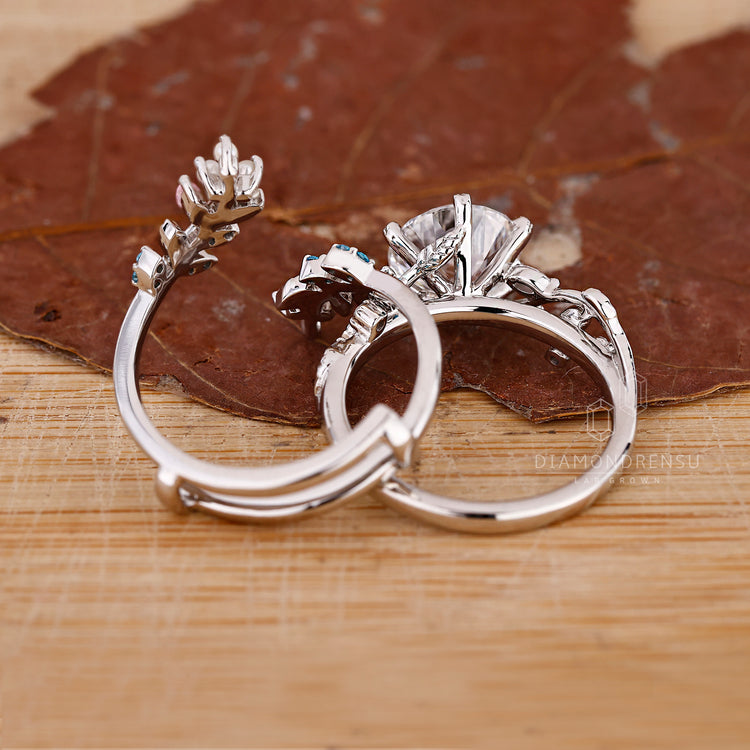 Marquise and Round Side Stone Ring in a white gold bridal set.