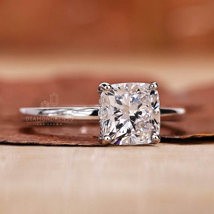 white gold engagement ring with hidden halo detail.
