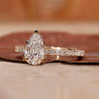 Elegant hidden halo setting with pear-shaped diamond