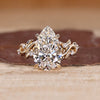 Pear Cut Diamond Ring with round side stones.
