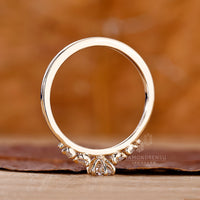 Yellow gold engagement ring has round cut side stone.
