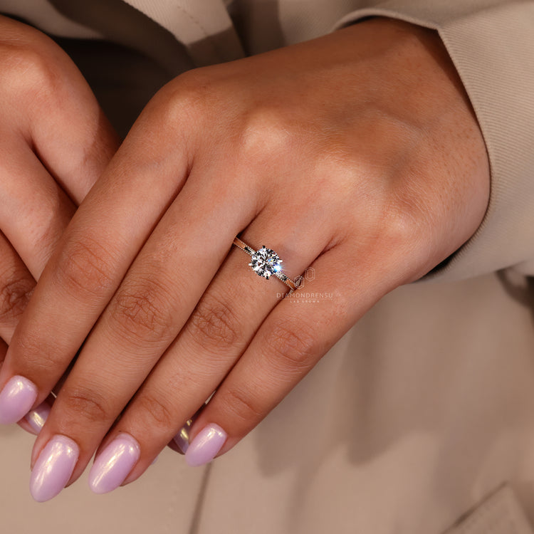 Handmade ring shows yellow gold engagement ring.
