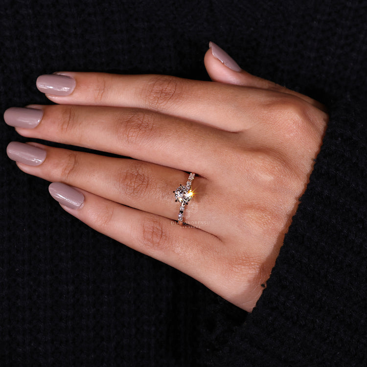 Jubilee cut diamond ring in pave ring setting.
