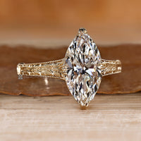 Art Deco marquise diamond ring with milgrain details.