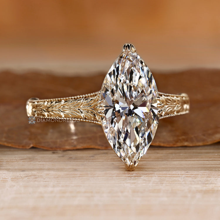 Art Deco marquise diamond ring with milgrain details.