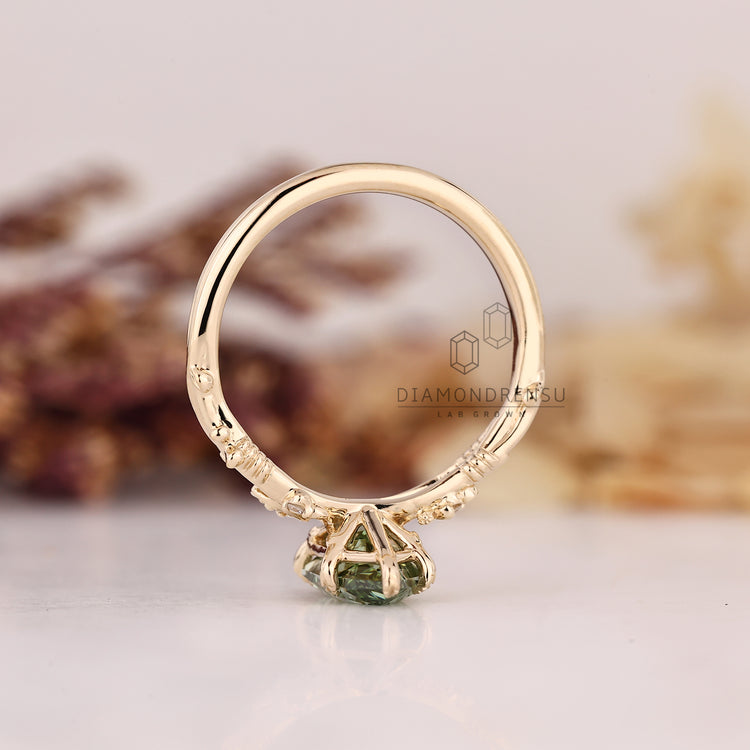 Dutch marquise engagement ring with lab grown green diamond.
