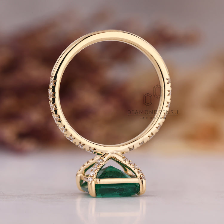 Handmade Asscher emerald ring pave four claw setting.
