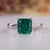 Asscher cut emerald ring solitaire cathedral prong set.
