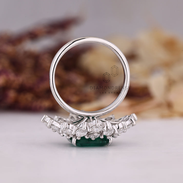 Asscher emerald ring marquise stones nature style set.
