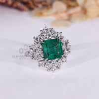 Asscher emerald ring twisted shank four claw prong set.
