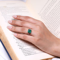 Asscher cut ring emerald pave four claw prong setting.
