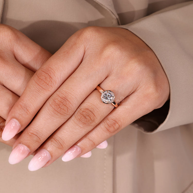 Round diamond ring IGI certified halo bezel set.
