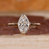 Marquise diamond ring solitaire bezel setting pinch shank.
